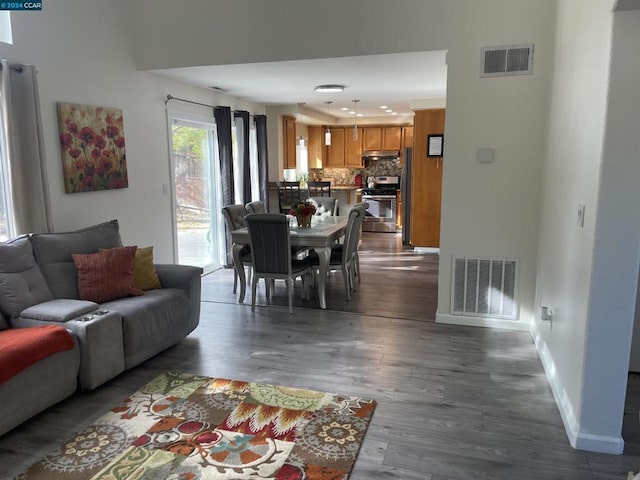 living room with dark hardwood / wood-style floors