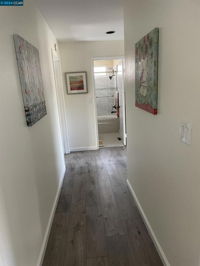 corridor featuring dark hardwood / wood-style floors