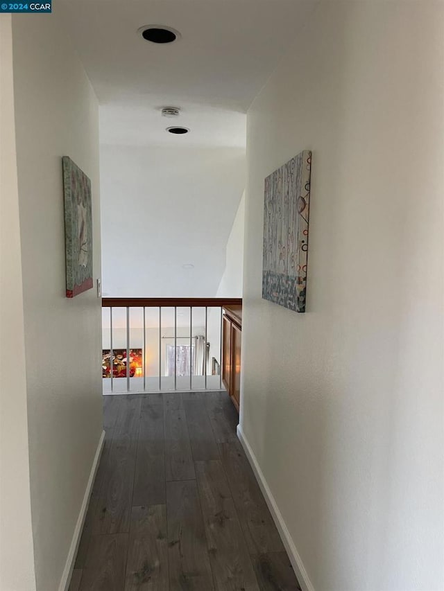 corridor featuring dark hardwood / wood-style floors