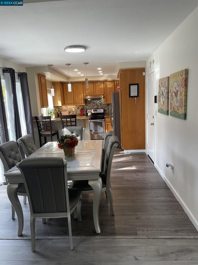 dining room featuring dark hardwood / wood-style flooring