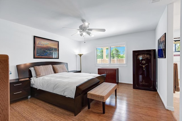 bedroom with ceiling fan and light hardwood / wood-style flooring