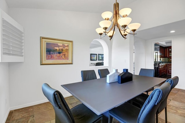 dining space with a notable chandelier