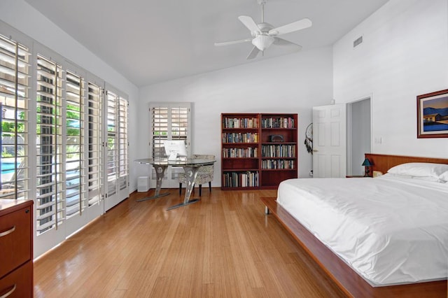 bedroom featuring light wood-type flooring, ceiling fan, lofted ceiling, and access to outside