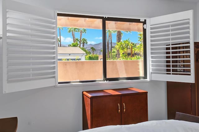 unfurnished bedroom featuring a mountain view