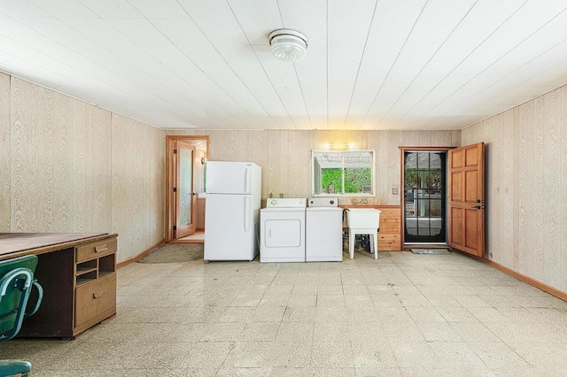 washroom featuring sink and washing machine and clothes dryer