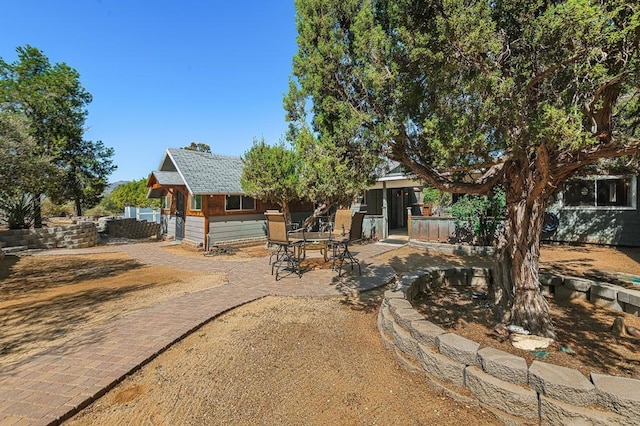 view of front of home featuring a patio