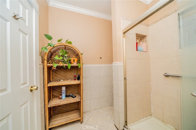 bathroom with ornamental molding, a shower with door, and tile patterned floors