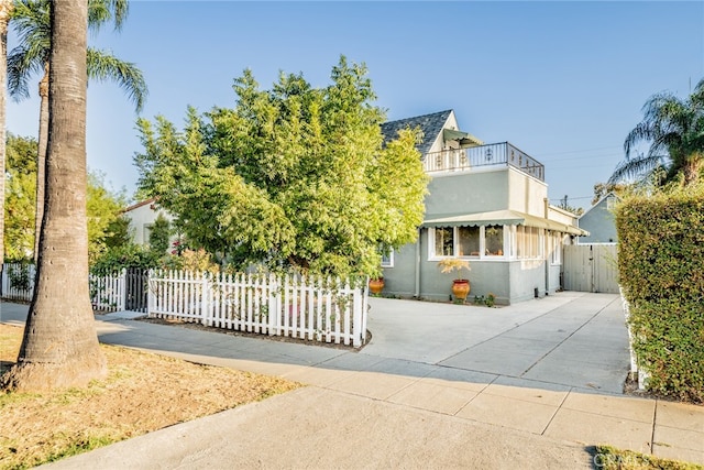 view of front of home with a balcony