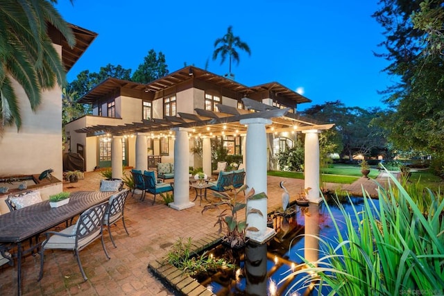 view of patio featuring a pergola, a pool, and an outdoor hangout area