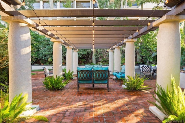 view of patio featuring an outdoor living space and a pergola