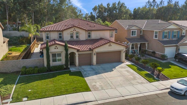 mediterranean / spanish-style home with a front yard and a garage