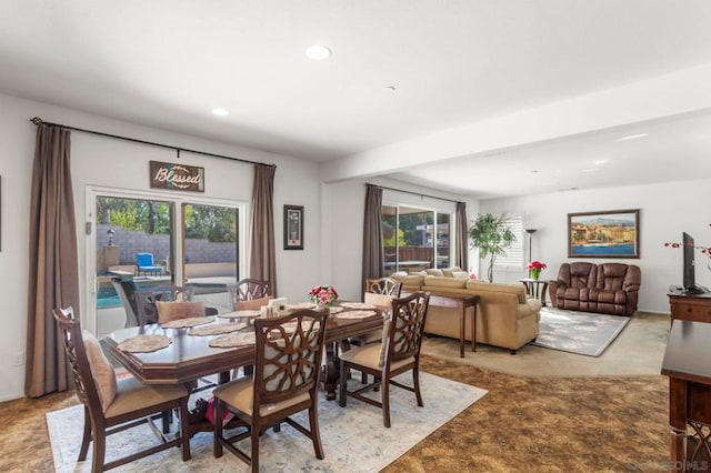 dining room featuring light colored carpet