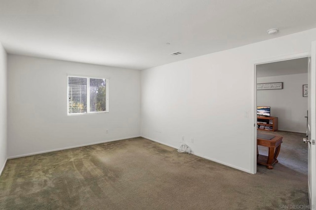 empty room featuring carpet flooring