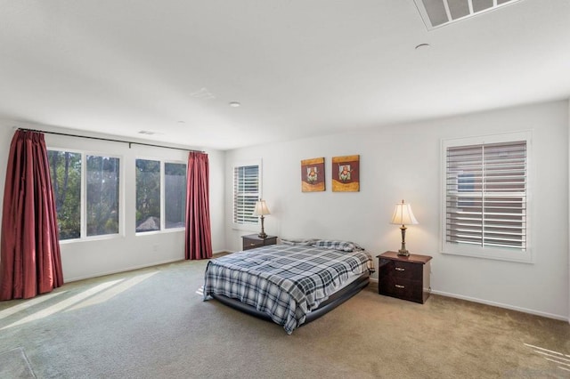 bedroom with light colored carpet