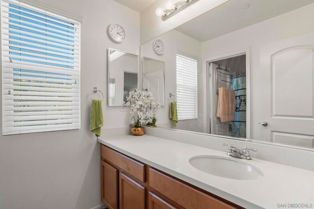 bathroom with vanity and a shower with shower curtain