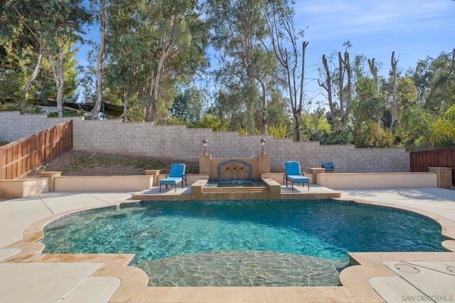 view of pool featuring a patio area