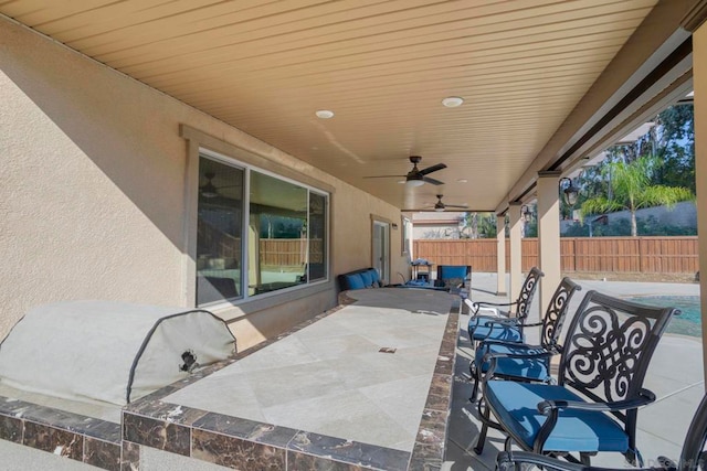 view of patio featuring ceiling fan