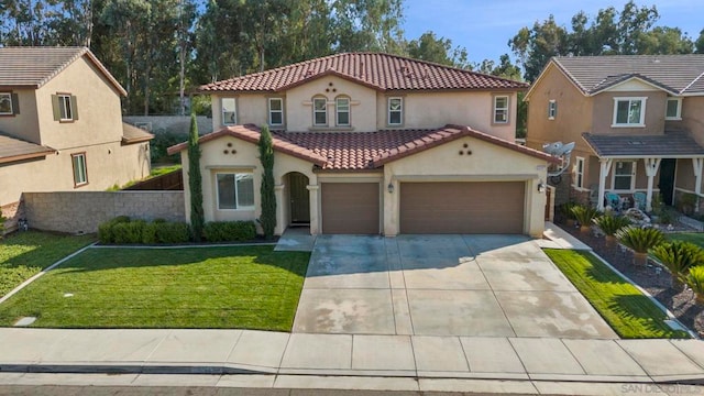 mediterranean / spanish-style home with a front yard