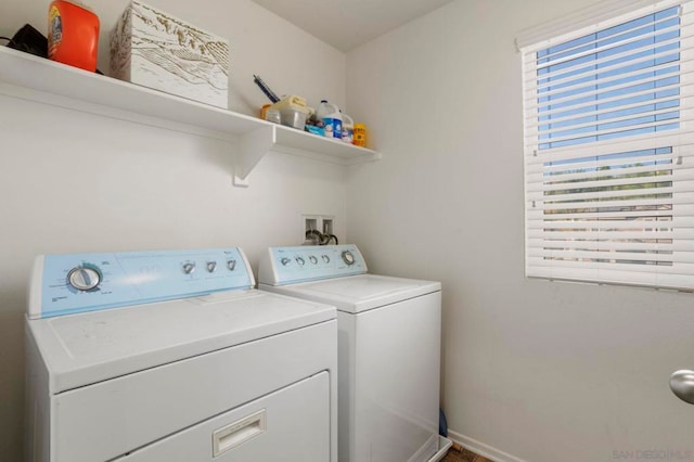 laundry room featuring separate washer and dryer