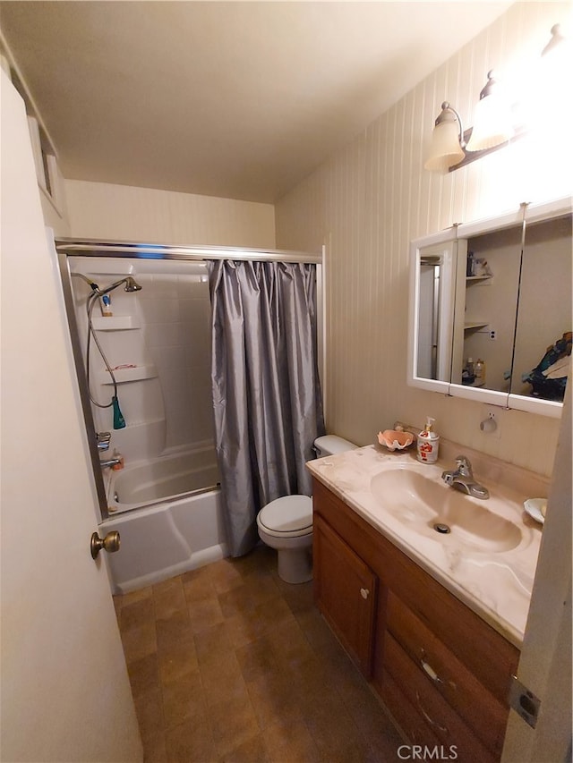 full bathroom with shower / tub combo, vanity, and toilet