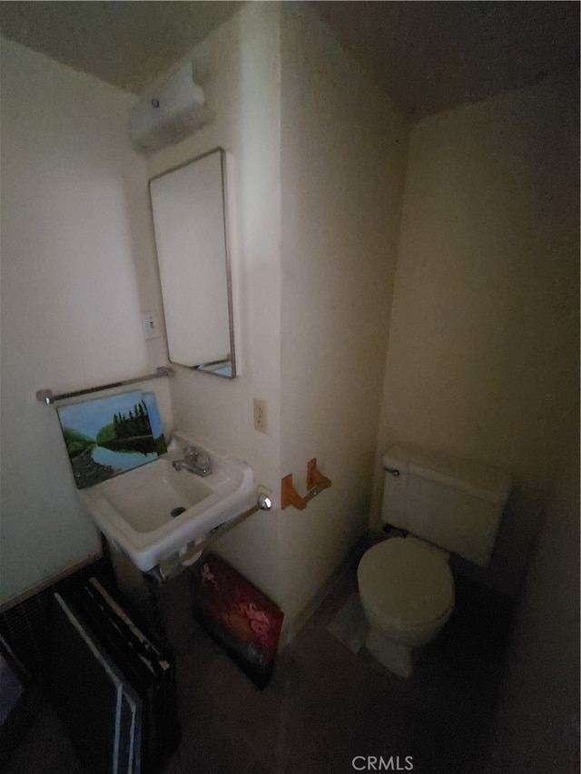 bathroom featuring sink and toilet