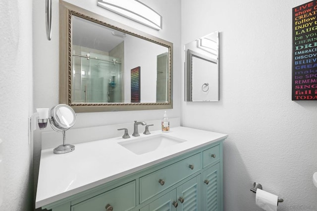 bathroom with vanity and walk in shower