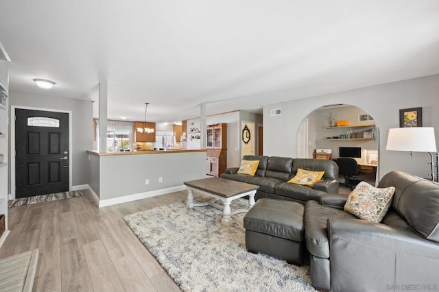 living room with light hardwood / wood-style floors