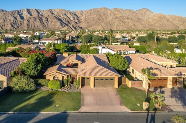 birds eye view of property with a mountain view