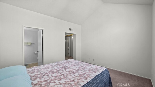 carpeted bedroom with lofted ceiling