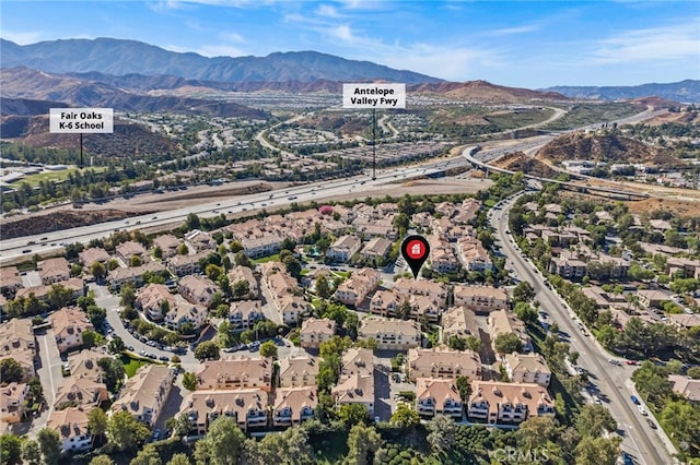 drone / aerial view featuring a mountain view