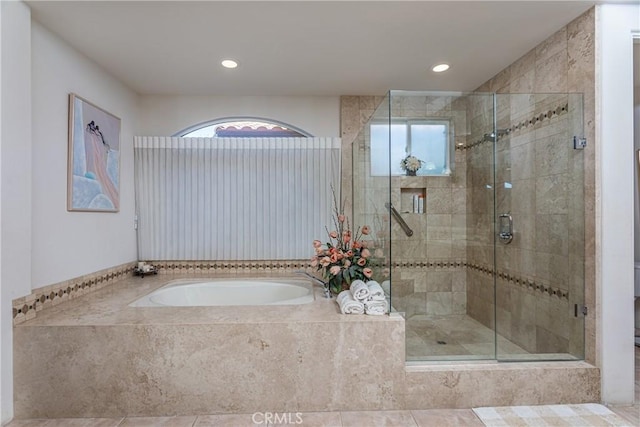 bathroom featuring toilet, tile patterned floors, and independent shower and bath