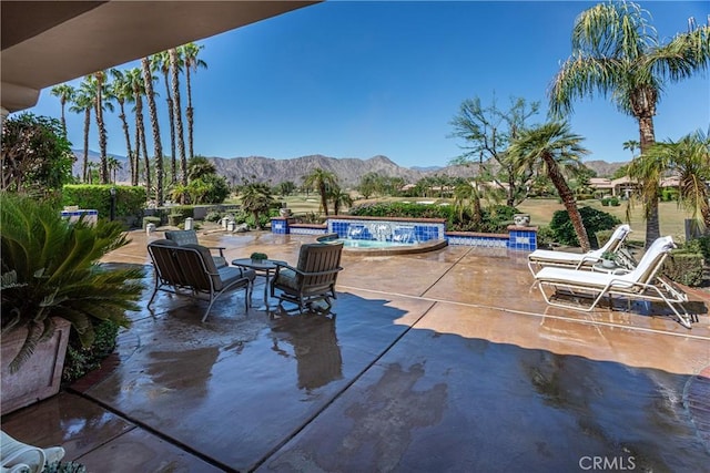 view of patio / terrace featuring a mountain view