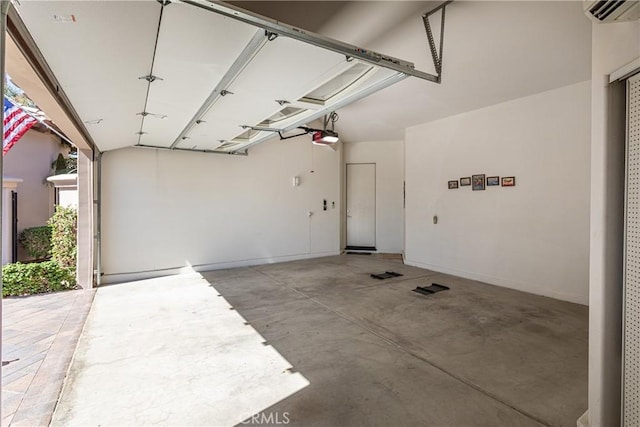 garage featuring a garage door opener and a wall mounted AC