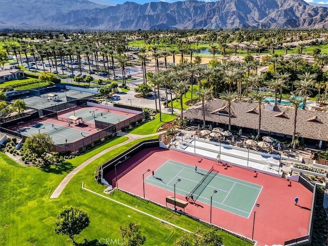 birds eye view of property with a mountain view