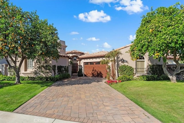 mediterranean / spanish-style house with a front yard