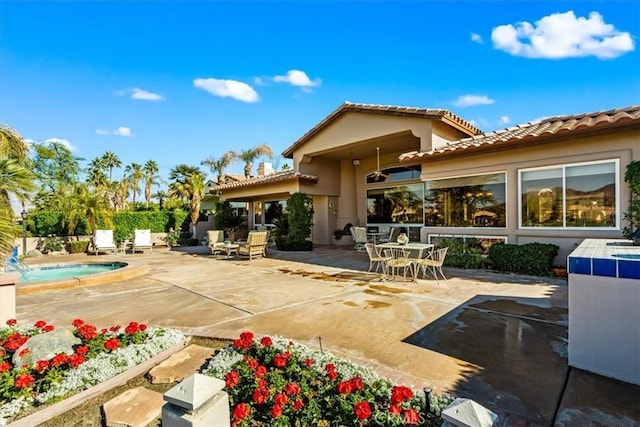 back of house with a patio area