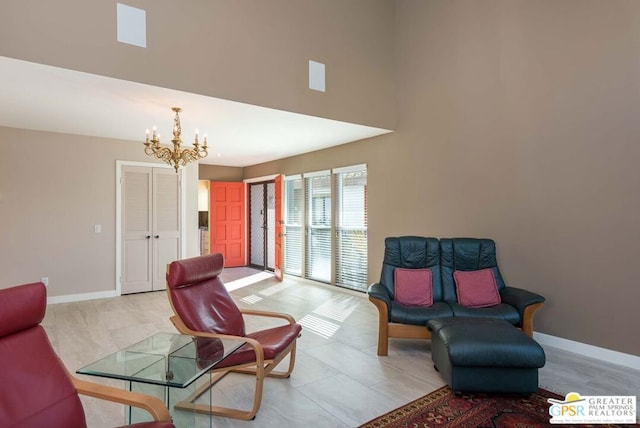 living area featuring an inviting chandelier