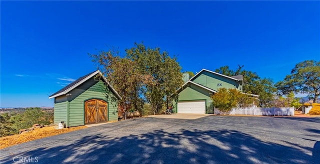 view of front of property featuring a garage