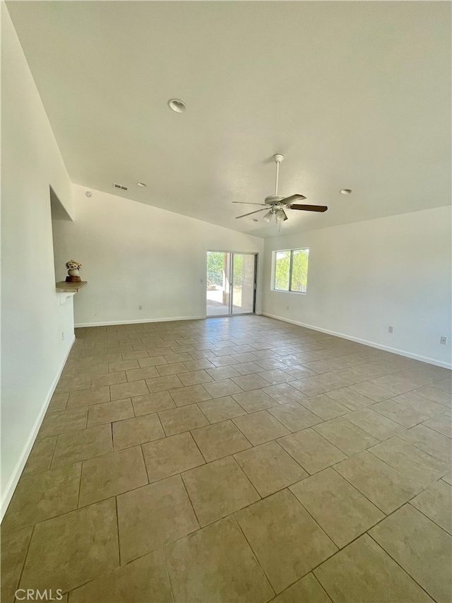 unfurnished room featuring light tile patterned floors and ceiling fan