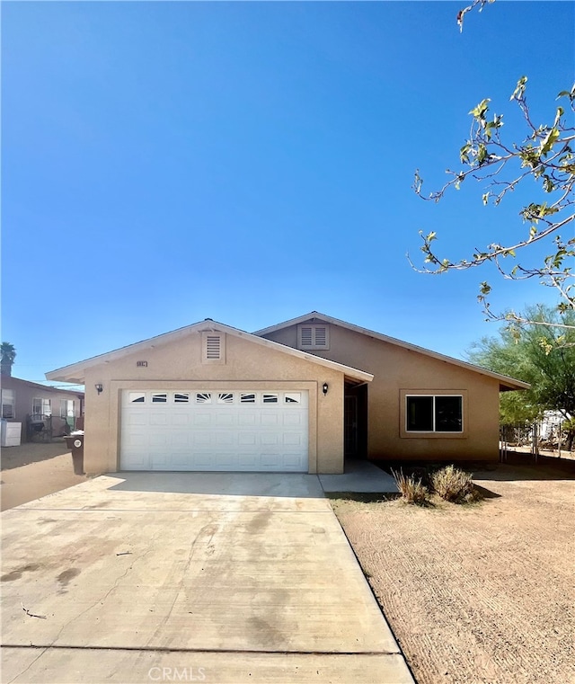 single story home featuring a garage