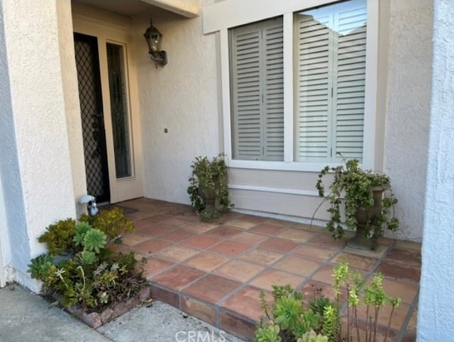 doorway to property with a patio area