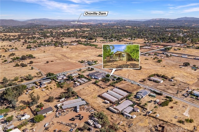 drone / aerial view featuring a mountain view