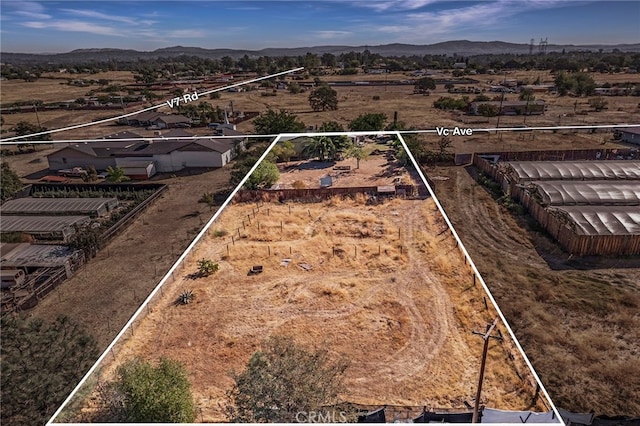 bird's eye view with a rural view and a mountain view