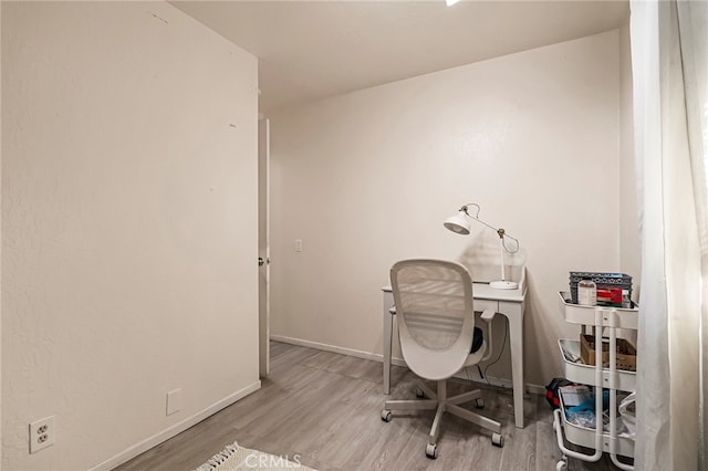 office space with light hardwood / wood-style floors