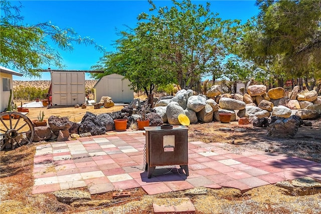 view of patio / terrace featuring a storage unit