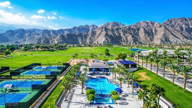 birds eye view of property with a mountain view