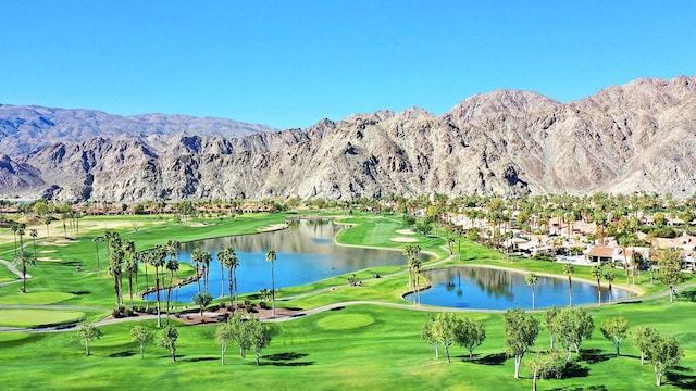 surrounding community featuring a water and mountain view