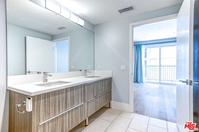 bathroom featuring hardwood / wood-style floors and vanity