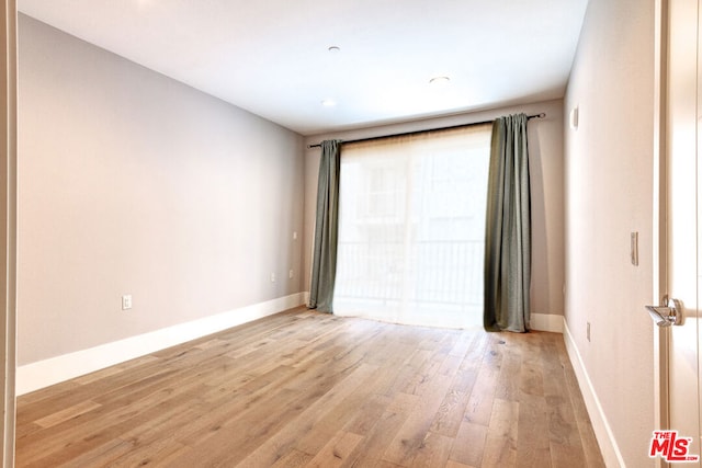 empty room featuring light hardwood / wood-style floors