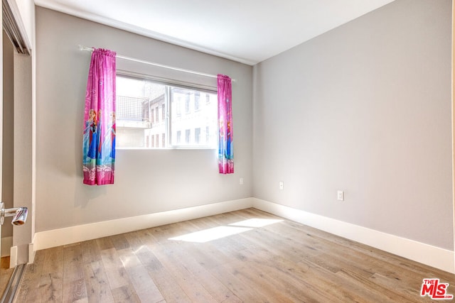 empty room featuring hardwood / wood-style flooring